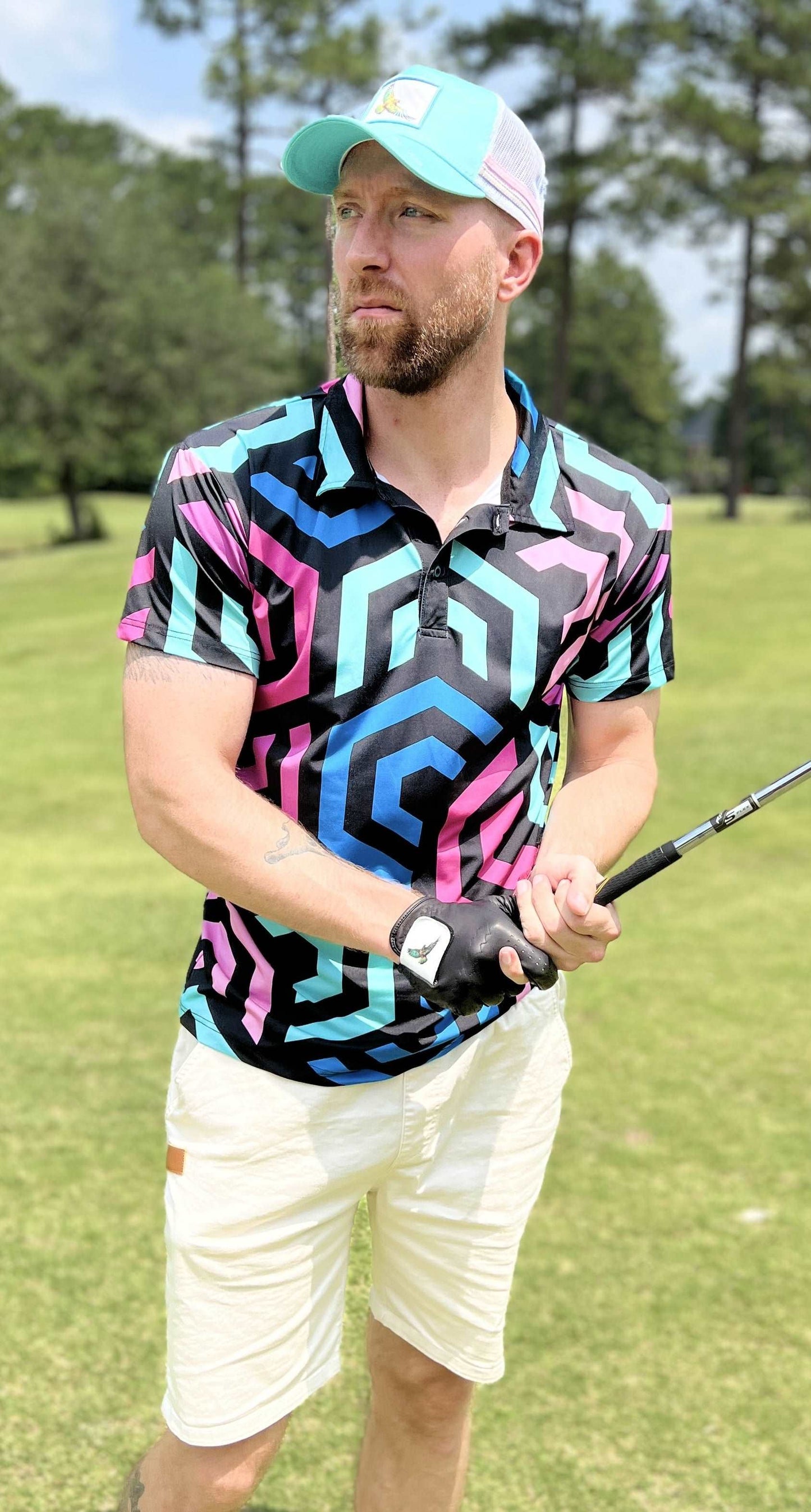 Pink, black and blue golf shirt with hexagonal pattern. pink golf polo