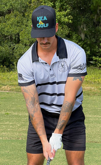 grey and black golf shirt with submarine warfare device. patriotic golf shirt. navy golf shirt. navy golf polo