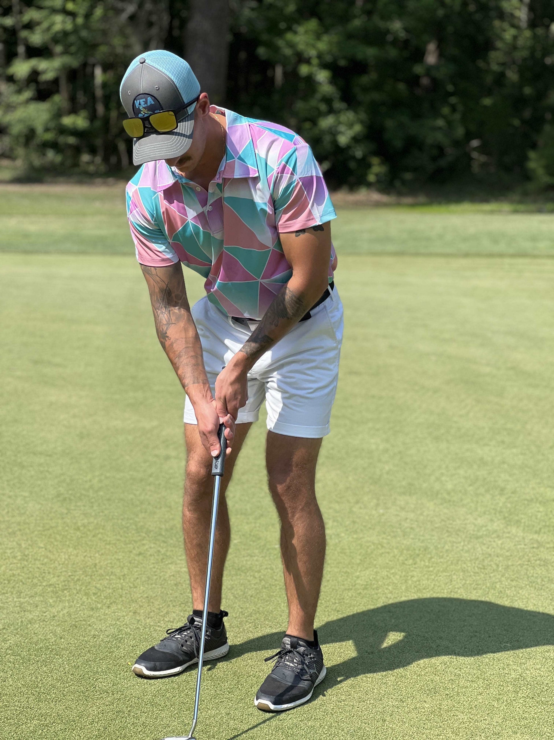 KEA Golf Men's Golf Hat "Blue Horizon" trucker style golf hat with mesh backing shown with Pink Pinseeker golf shirt