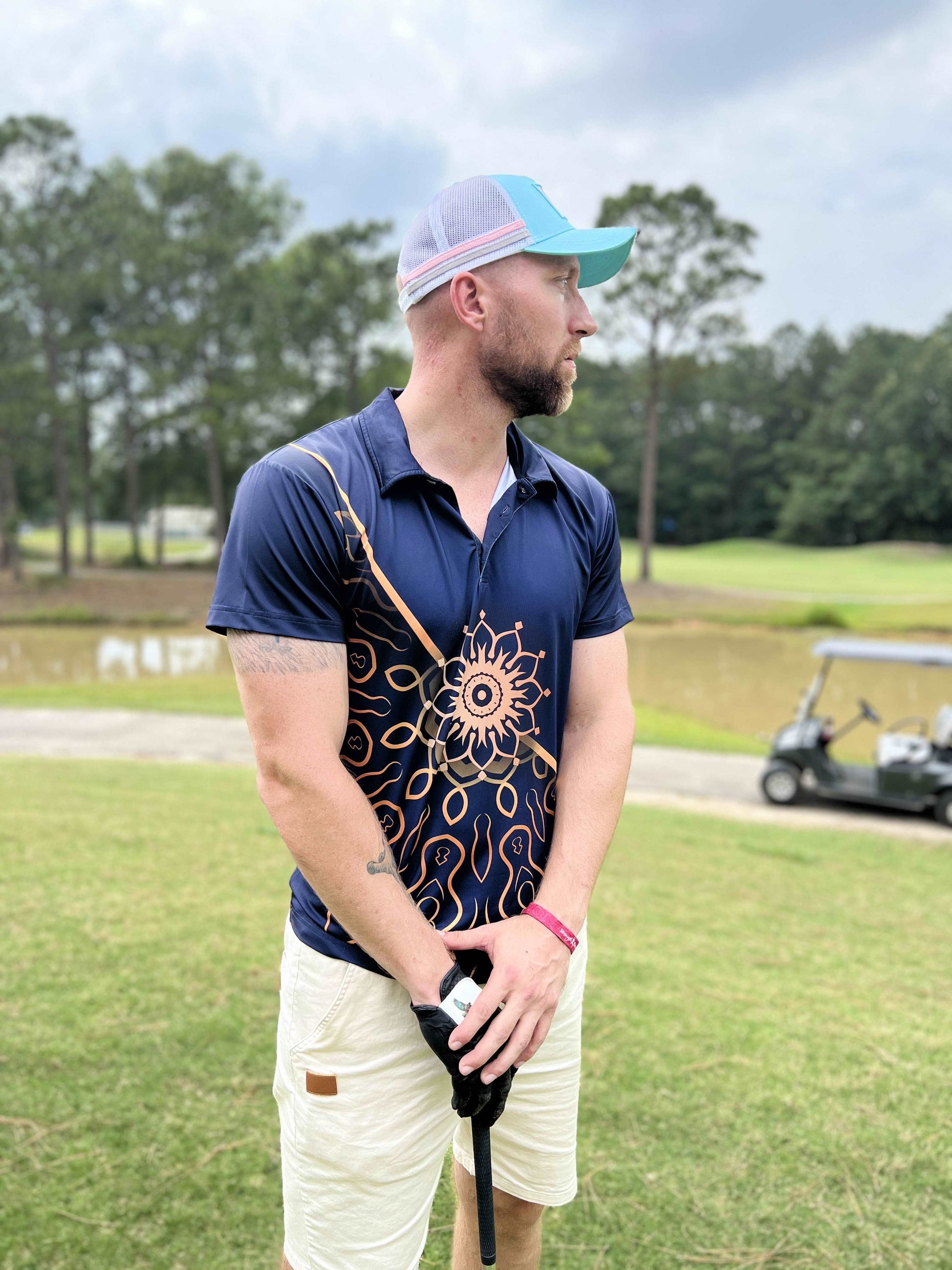 navy blue golf shirt with gold floral design. blue and gold golf polo. cheap golf shirts