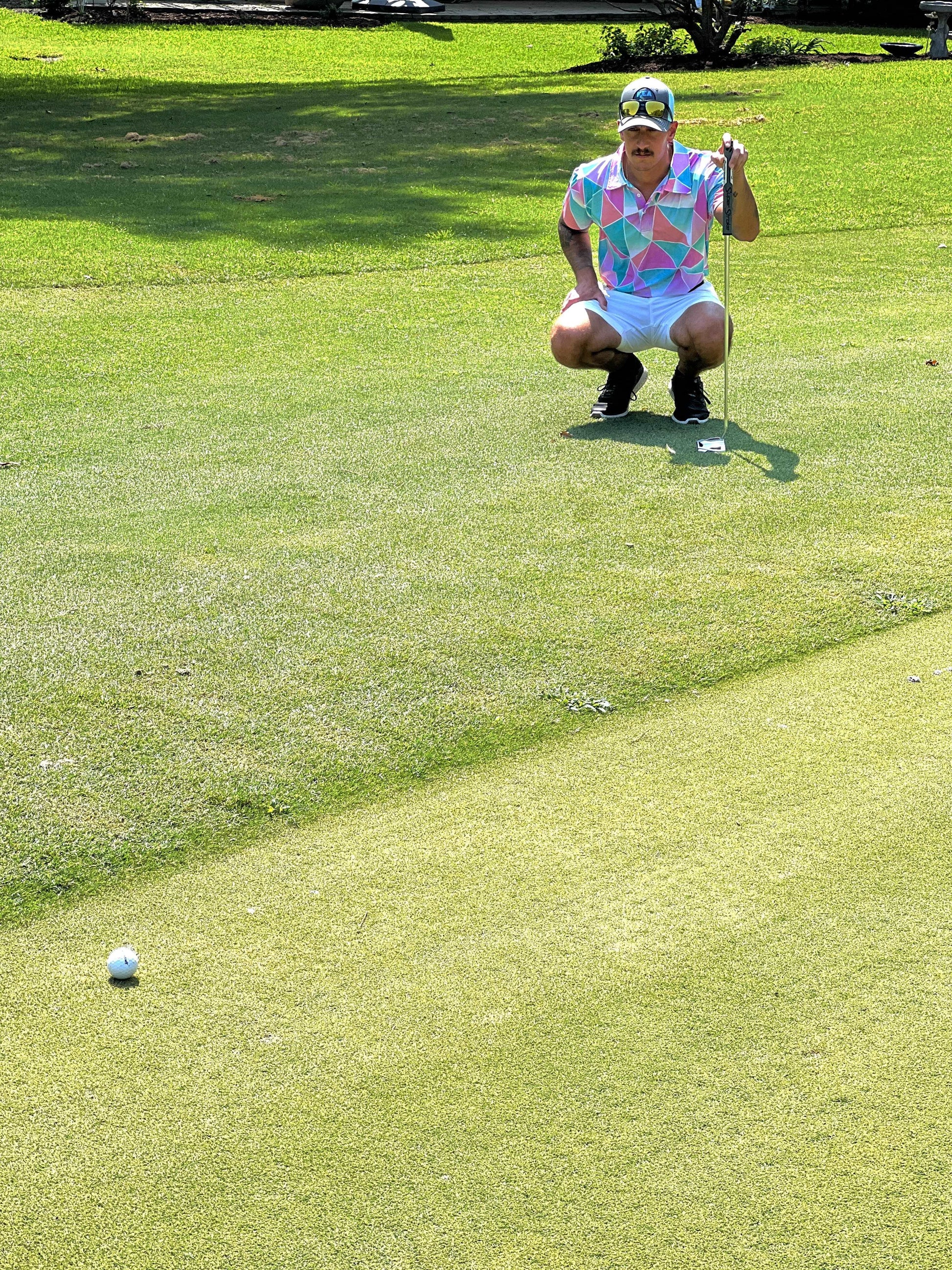 Pink and Cyan golf shirt with triangular pattern. pink golf polo. blue golf polo. cheap golf shirts