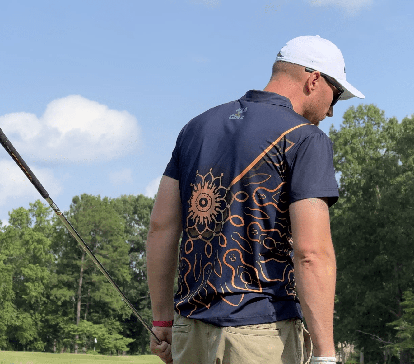 navy blue golf shirt with gold floral design. blue and gold golf polo. cheap golf shirts for men