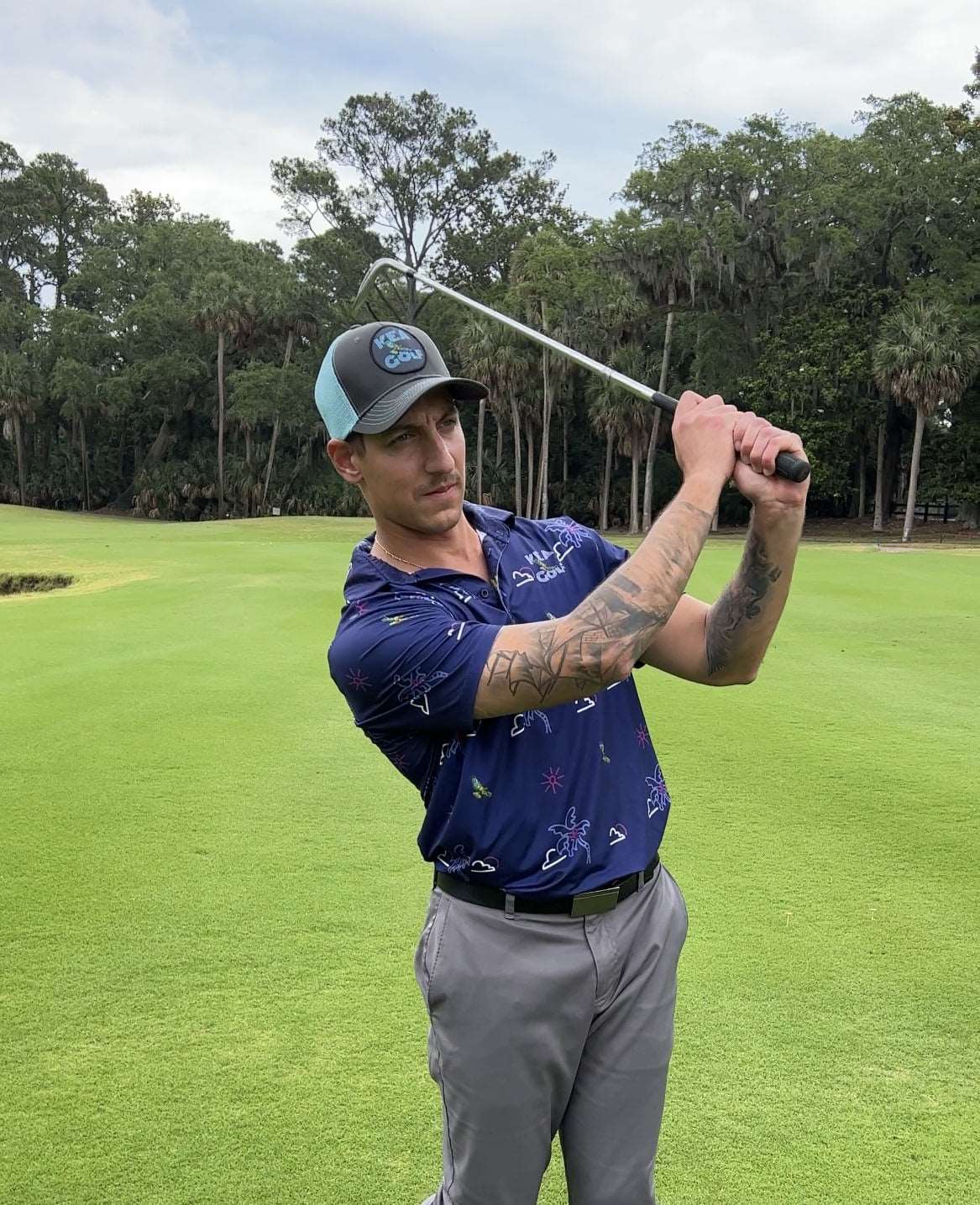 KEA Golf Men's Golf Hat "Blue Horizon" trucker style with mesh backing shown with KEA Paradise golf shirt