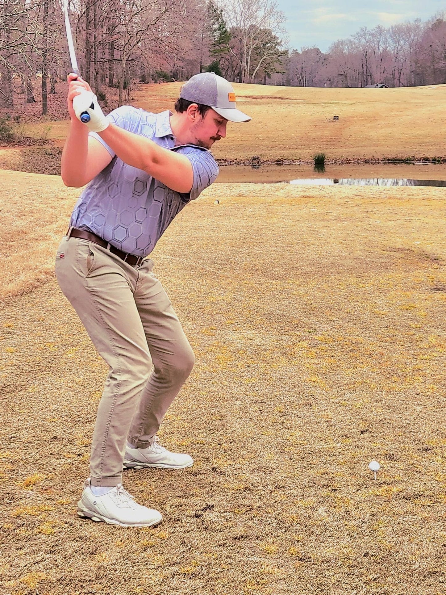 2024 KEA Golf “Graphite Grid” grey with subtle hexagonal pattern Golf polo (front). grey performance golf shirt. 