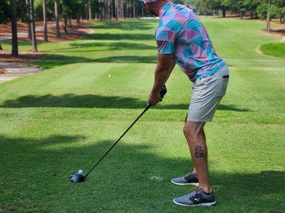 Pink and Cyan golf shirt with triangular pattern. pink golf polo. cheap golf shirts. fun pattern golf shirts. fun golf shirts for men